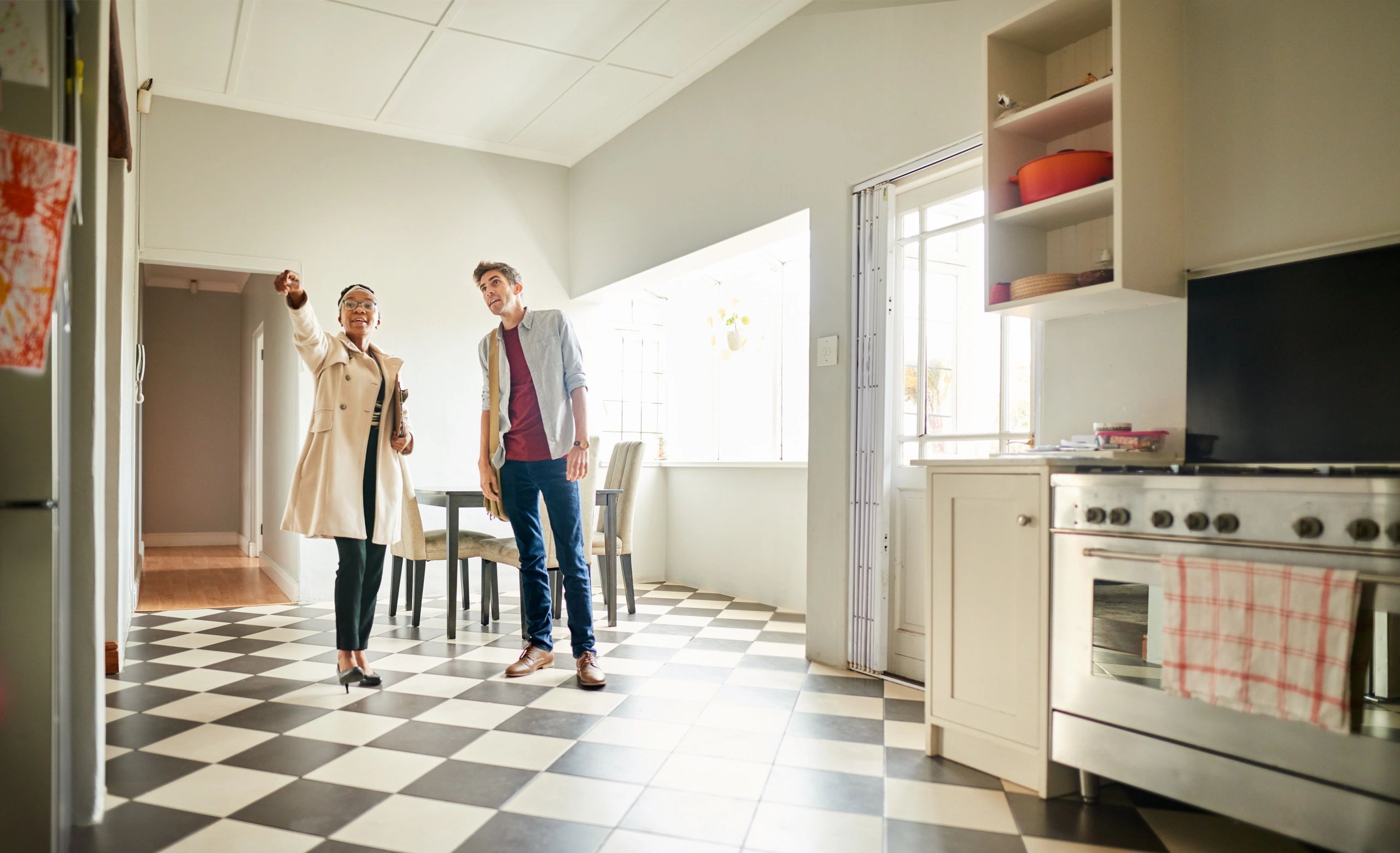 Real estate agent speaking with a client in a home