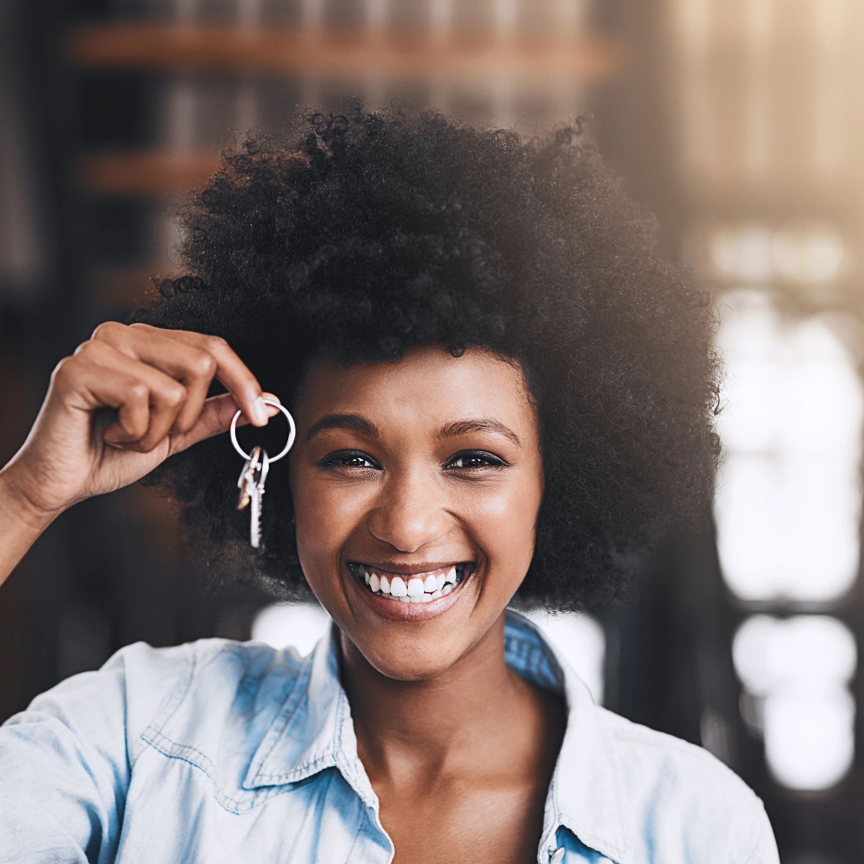 Woman holding keys to a new home